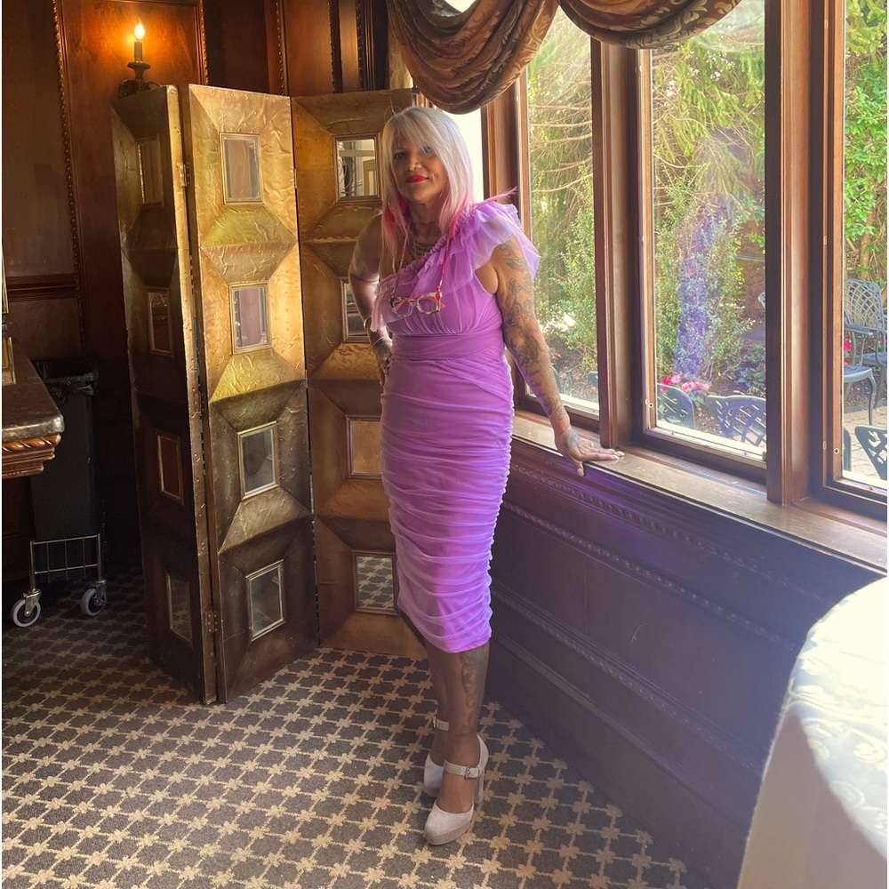 A nice purple dress wore it once for a wedding  is size medium